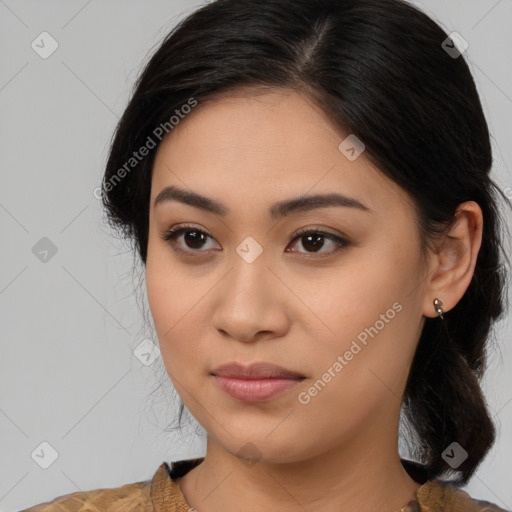 Joyful latino young-adult female with medium  brown hair and brown eyes