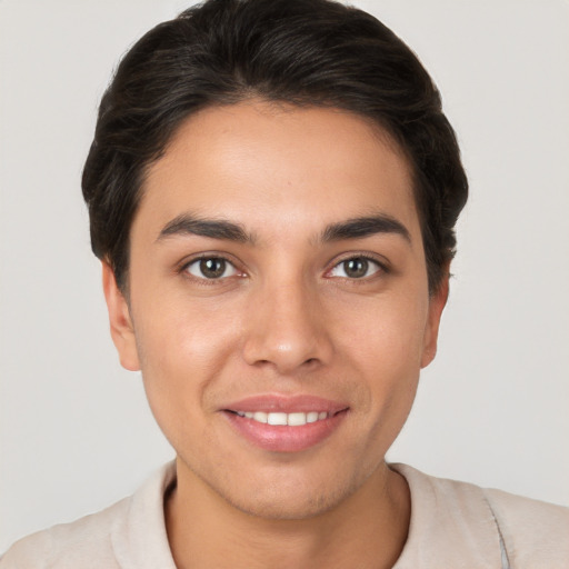 Joyful white young-adult female with short  brown hair and brown eyes