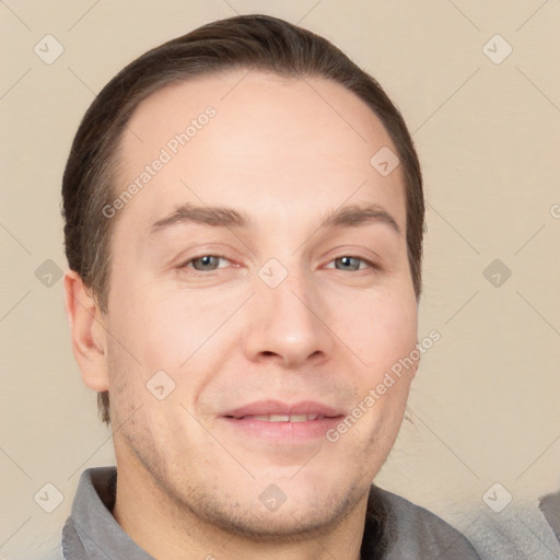 Joyful white adult male with short  brown hair and brown eyes