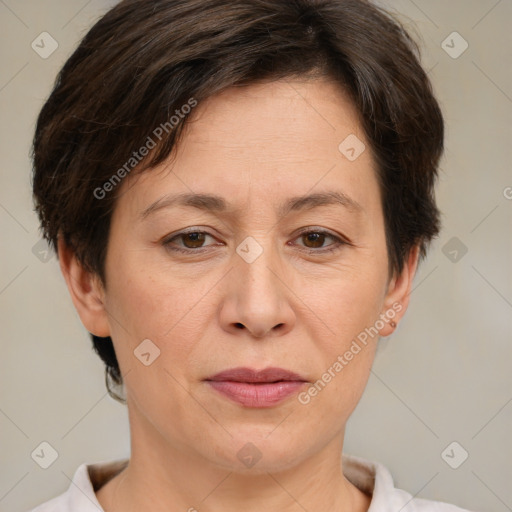 Joyful white adult female with short  brown hair and brown eyes