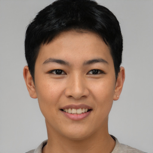 Joyful asian young-adult female with short  black hair and brown eyes