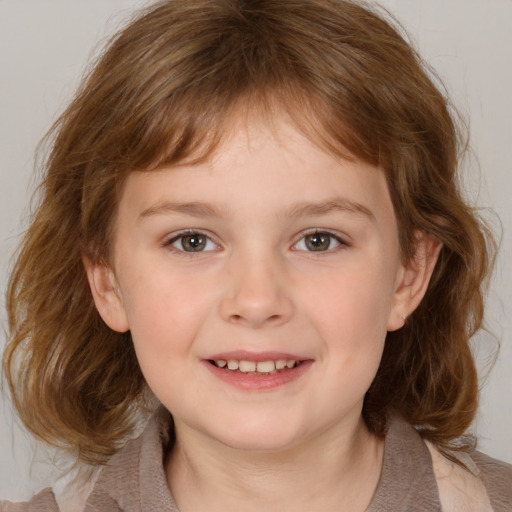 Joyful white child female with medium  brown hair and brown eyes