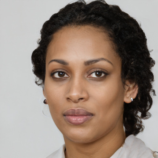 Neutral black young-adult female with medium  black hair and brown eyes