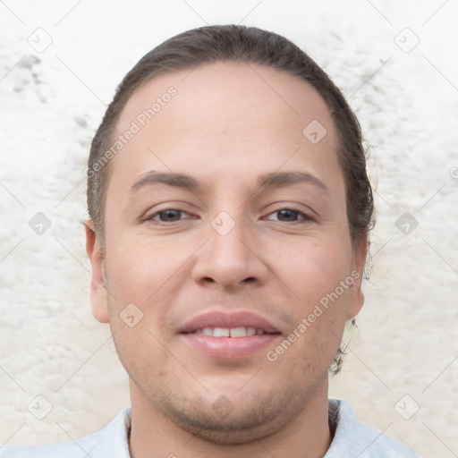 Joyful white young-adult male with short  brown hair and brown eyes