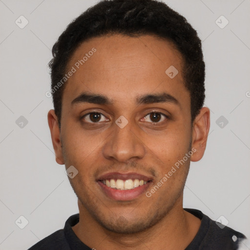 Joyful black young-adult male with short  brown hair and brown eyes