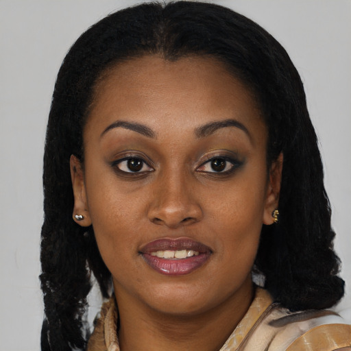 Joyful black young-adult female with long  brown hair and brown eyes