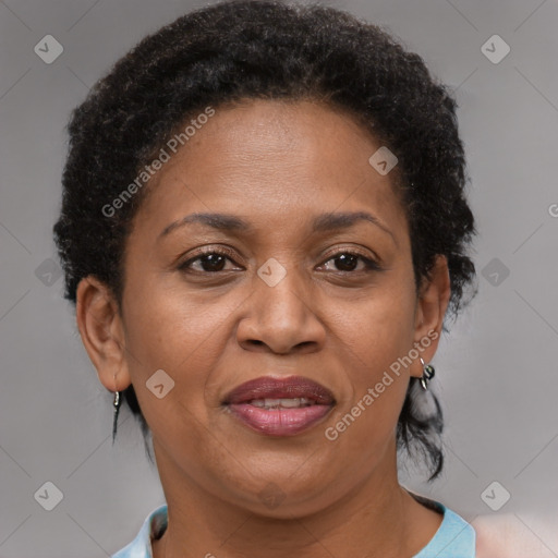 Joyful black adult female with short  brown hair and brown eyes