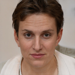 Joyful white adult female with short  brown hair and brown eyes