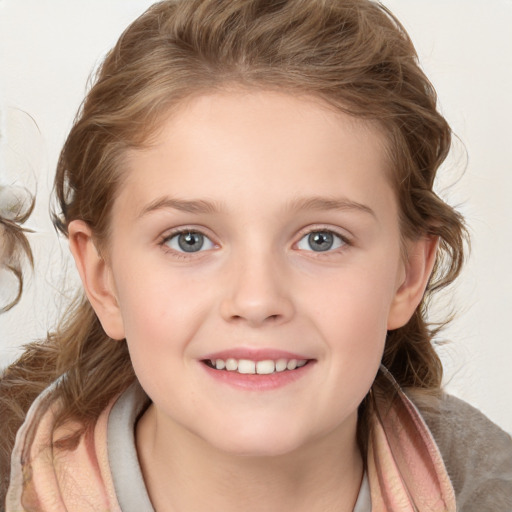 Joyful white child female with long  brown hair and blue eyes