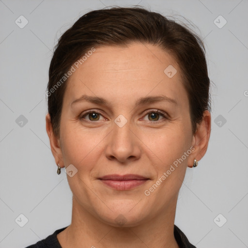 Joyful white adult female with short  brown hair and grey eyes