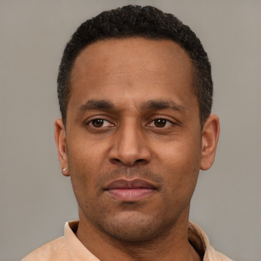 Neutral latino adult male with short  black hair and brown eyes