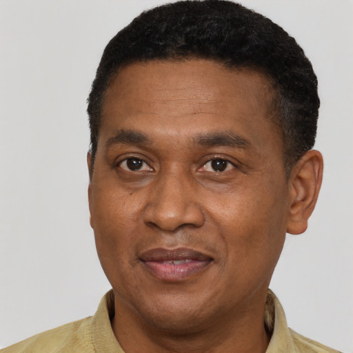 Joyful latino adult male with short  black hair and brown eyes