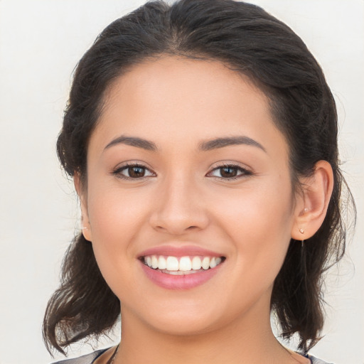 Joyful white young-adult female with medium  brown hair and brown eyes