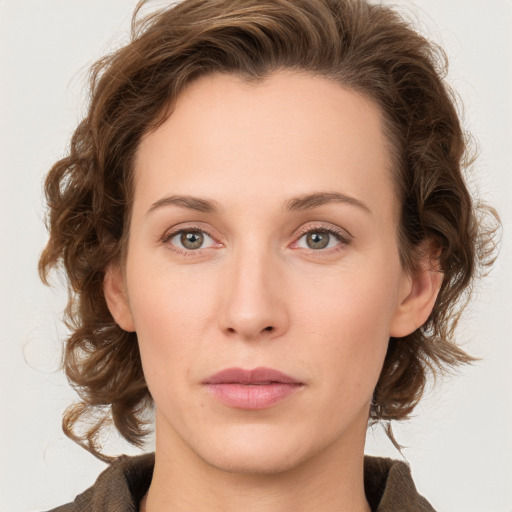 Neutral white young-adult female with medium  brown hair and green eyes