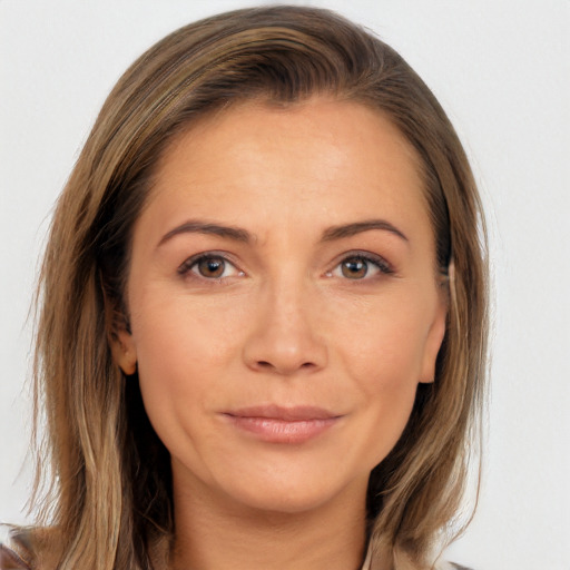 Joyful white adult female with long  brown hair and brown eyes