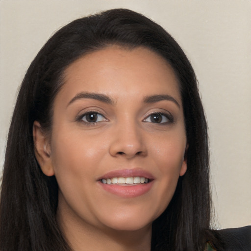 Joyful white young-adult female with long  black hair and brown eyes