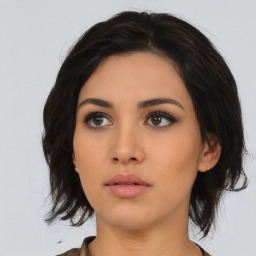 Neutral asian young-adult female with medium  black hair and brown eyes