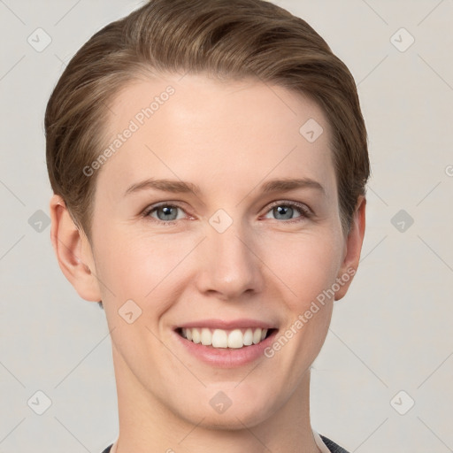 Joyful white young-adult female with short  brown hair and grey eyes