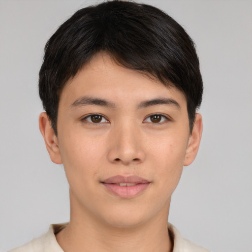 Joyful asian young-adult male with short  brown hair and brown eyes