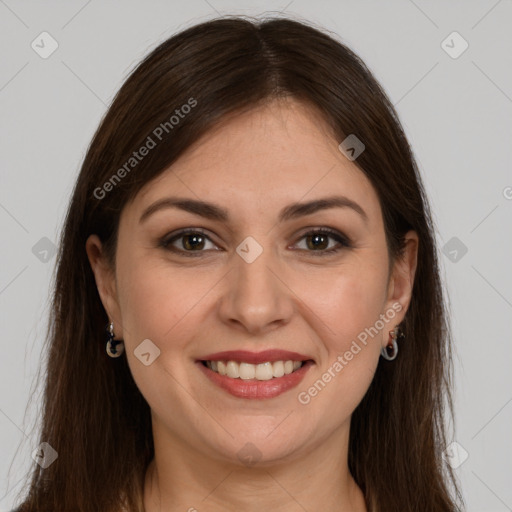 Joyful white young-adult female with long  brown hair and brown eyes