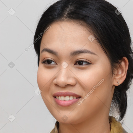 Joyful asian young-adult female with long  brown hair and brown eyes