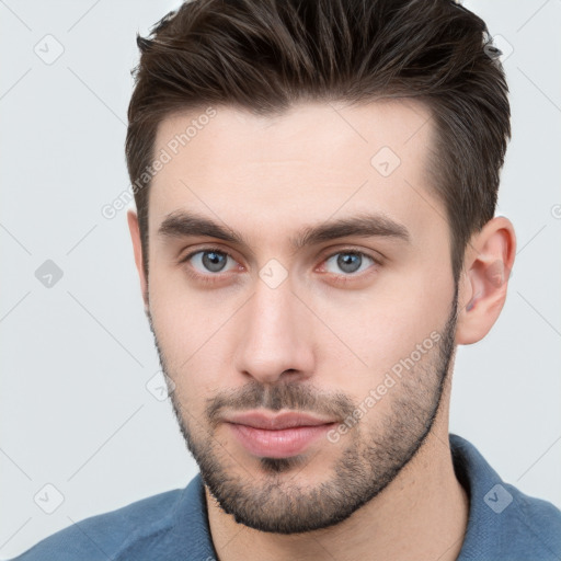 Neutral white young-adult male with short  brown hair and brown eyes