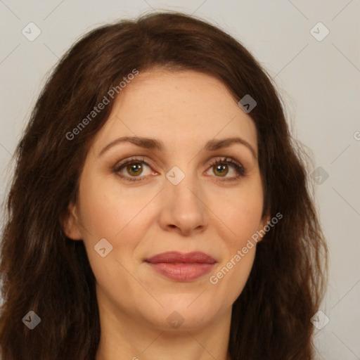 Joyful white adult female with long  brown hair and brown eyes