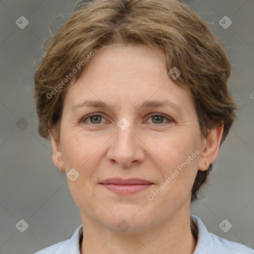 Joyful white adult female with short  brown hair and grey eyes