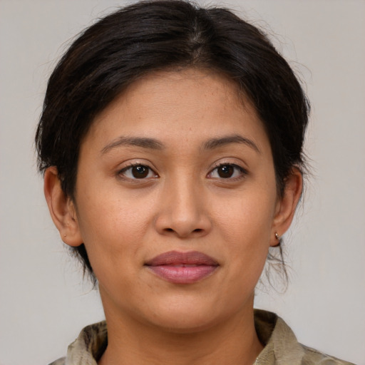 Joyful white young-adult female with medium  brown hair and brown eyes