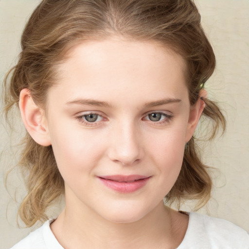 Joyful white child female with medium  brown hair and blue eyes