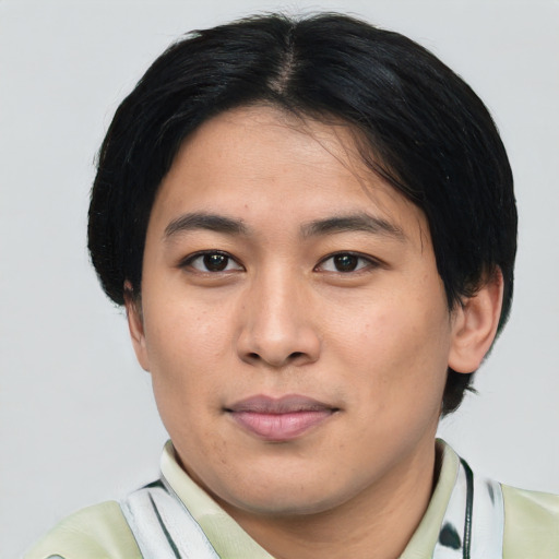 Joyful asian young-adult male with short  black hair and brown eyes