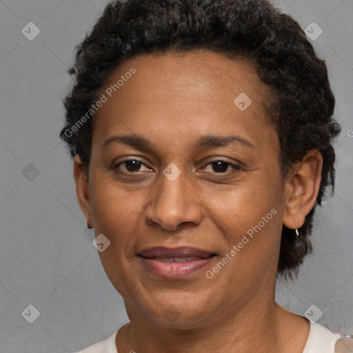 Joyful black adult female with short  brown hair and brown eyes