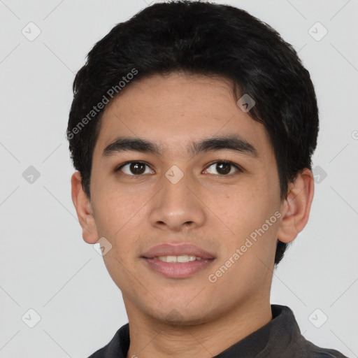 Joyful asian young-adult male with short  black hair and brown eyes