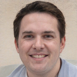 Joyful white adult male with short  brown hair and brown eyes