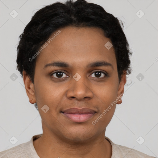 Joyful black young-adult female with short  brown hair and brown eyes