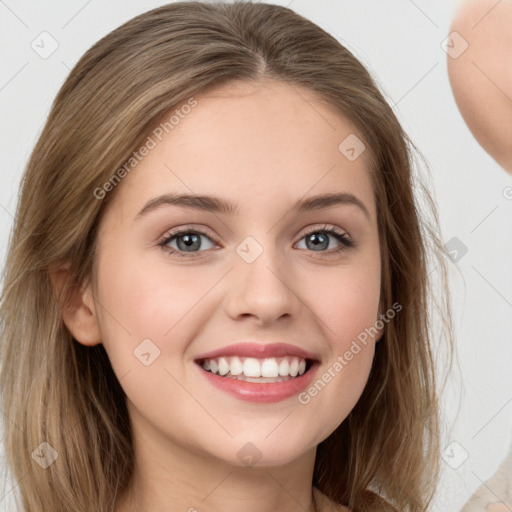 Joyful white young-adult female with long  brown hair and grey eyes