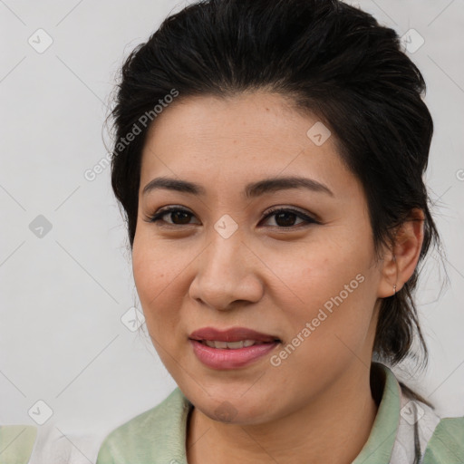 Joyful latino young-adult female with medium  brown hair and brown eyes