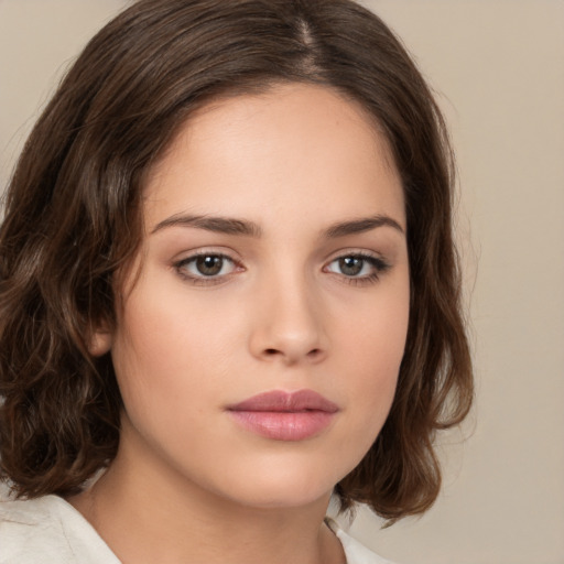 Neutral white young-adult female with medium  brown hair and brown eyes