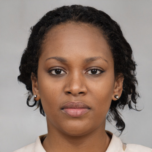 Neutral black young-adult female with medium  black hair and brown eyes