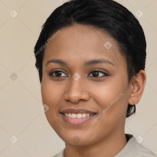 Joyful asian young-adult female with short  black hair and brown eyes