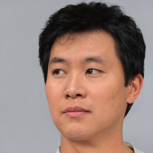 Neutral asian young-adult male with short  black hair and brown eyes