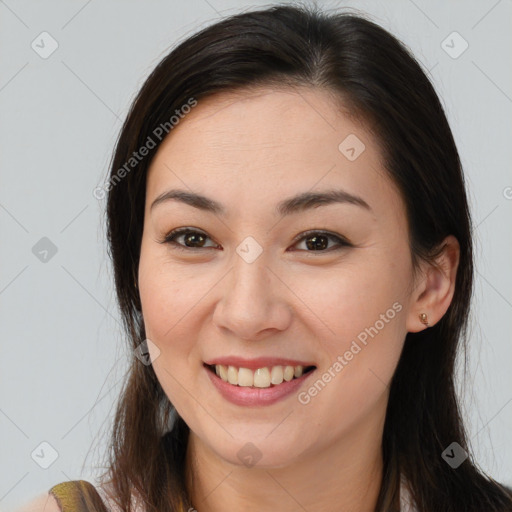 Joyful white young-adult female with long  brown hair and brown eyes