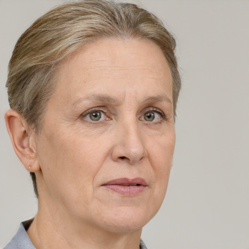 Joyful white middle-aged female with short  brown hair and brown eyes