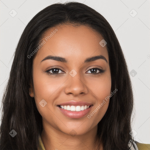 Joyful latino young-adult female with long  brown hair and brown eyes