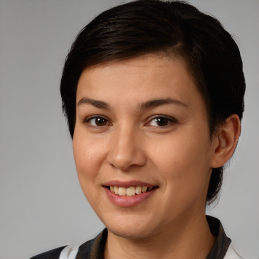 Joyful white young-adult female with short  brown hair and brown eyes