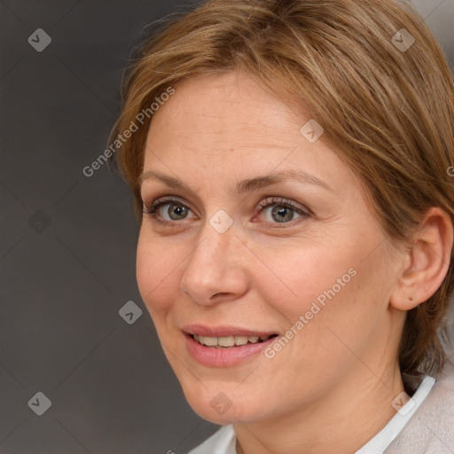 Joyful white adult female with medium  brown hair and brown eyes