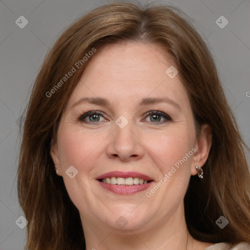 Joyful white adult female with medium  brown hair and grey eyes