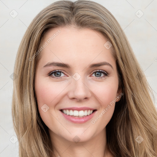 Joyful white young-adult female with long  brown hair and green eyes