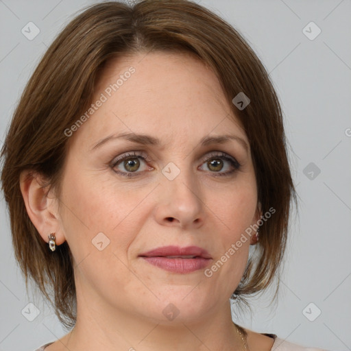 Joyful white adult female with medium  brown hair and grey eyes