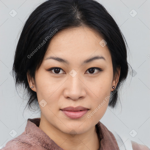 Joyful asian young-adult female with medium  black hair and brown eyes